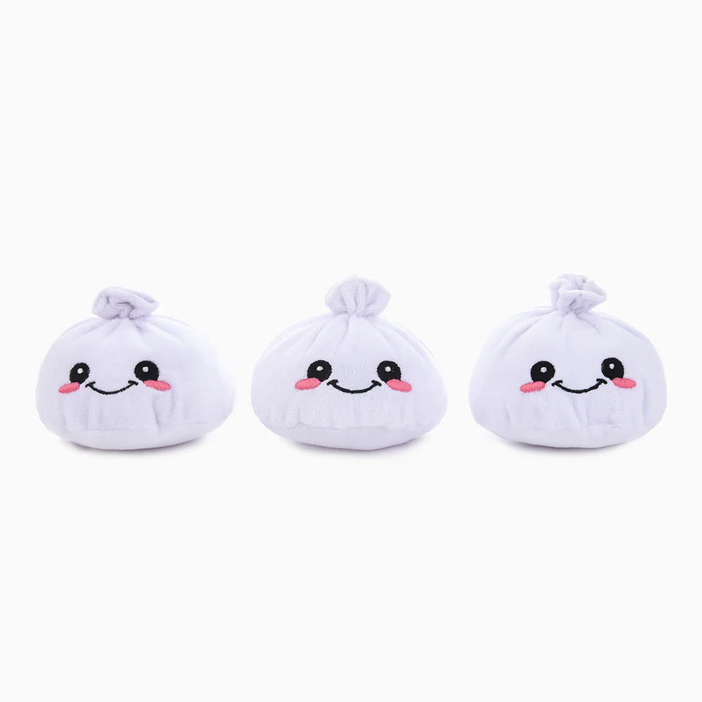 Three white dumpling hugsmart plush toys with smiling faces on a white background