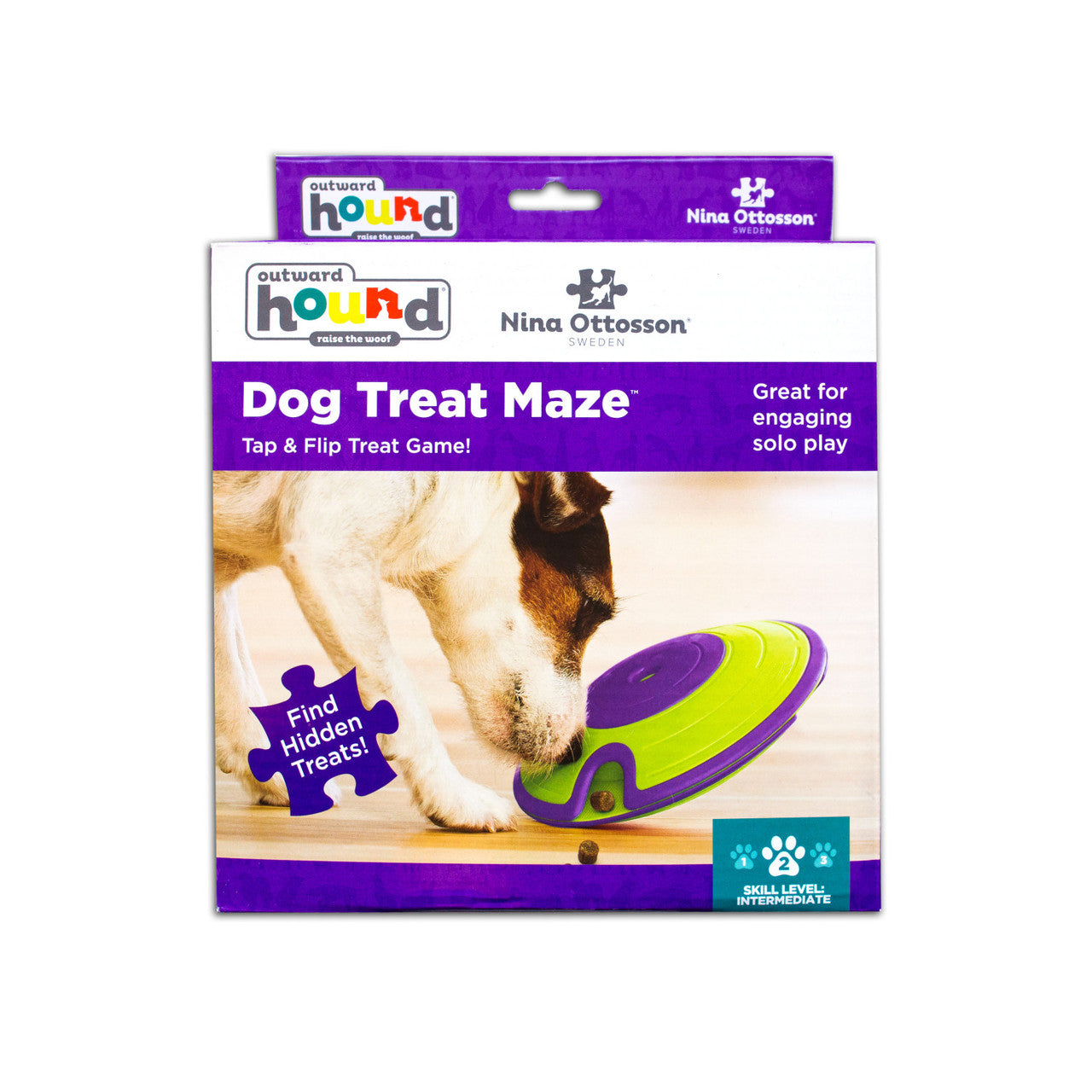 Outward Hound dog treat maze packaging with a dog interacting with it on a white background
