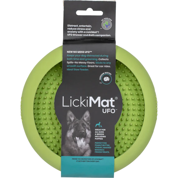 Green LickiMat UFO dog toy with packaging on a white background
