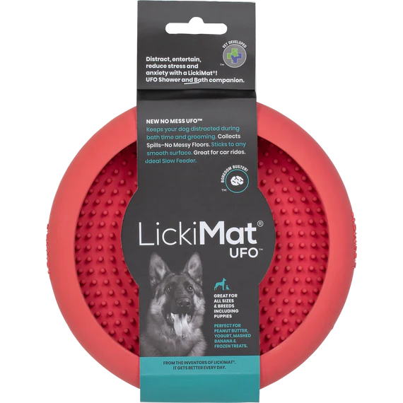 Red UFO-shaped LickiMat dog toy with packaging on a white background