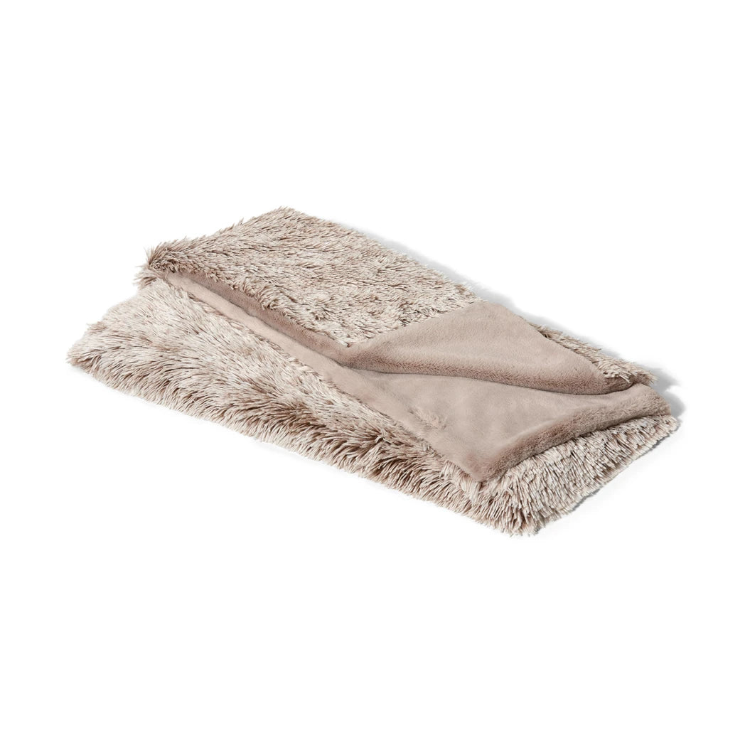 Beige Snooza blanket with fluffy texture on a white background