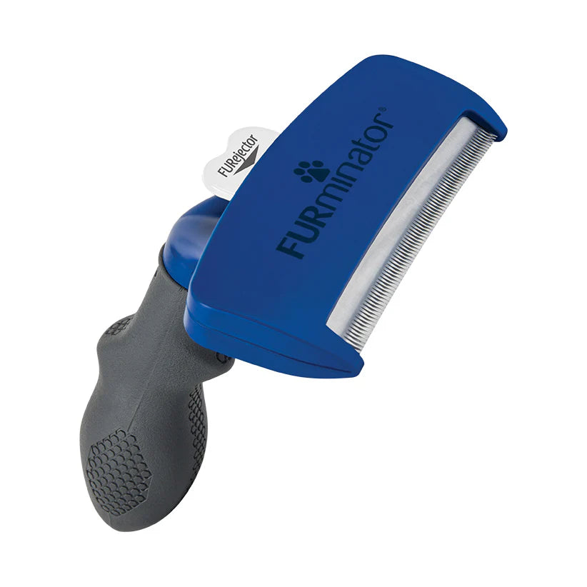 Blue and gray FURminator pet grooming tool on a white background