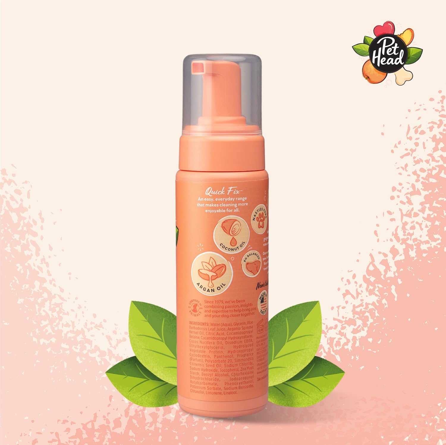 Pink bottle with pump dispenser on a light pink background with green leaves and Pet Head logo.
