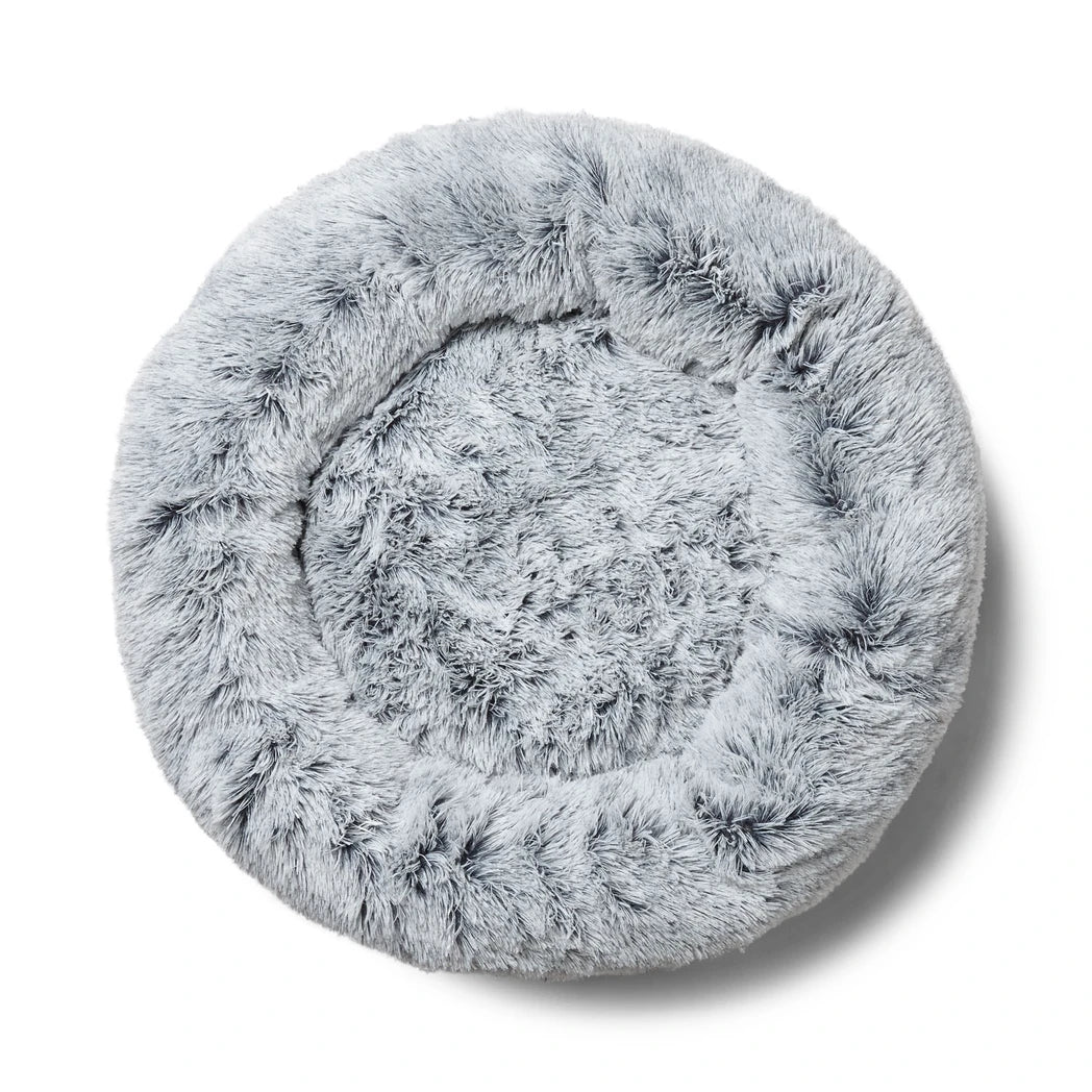 Fluffy gray Snooza pet bed on a white background